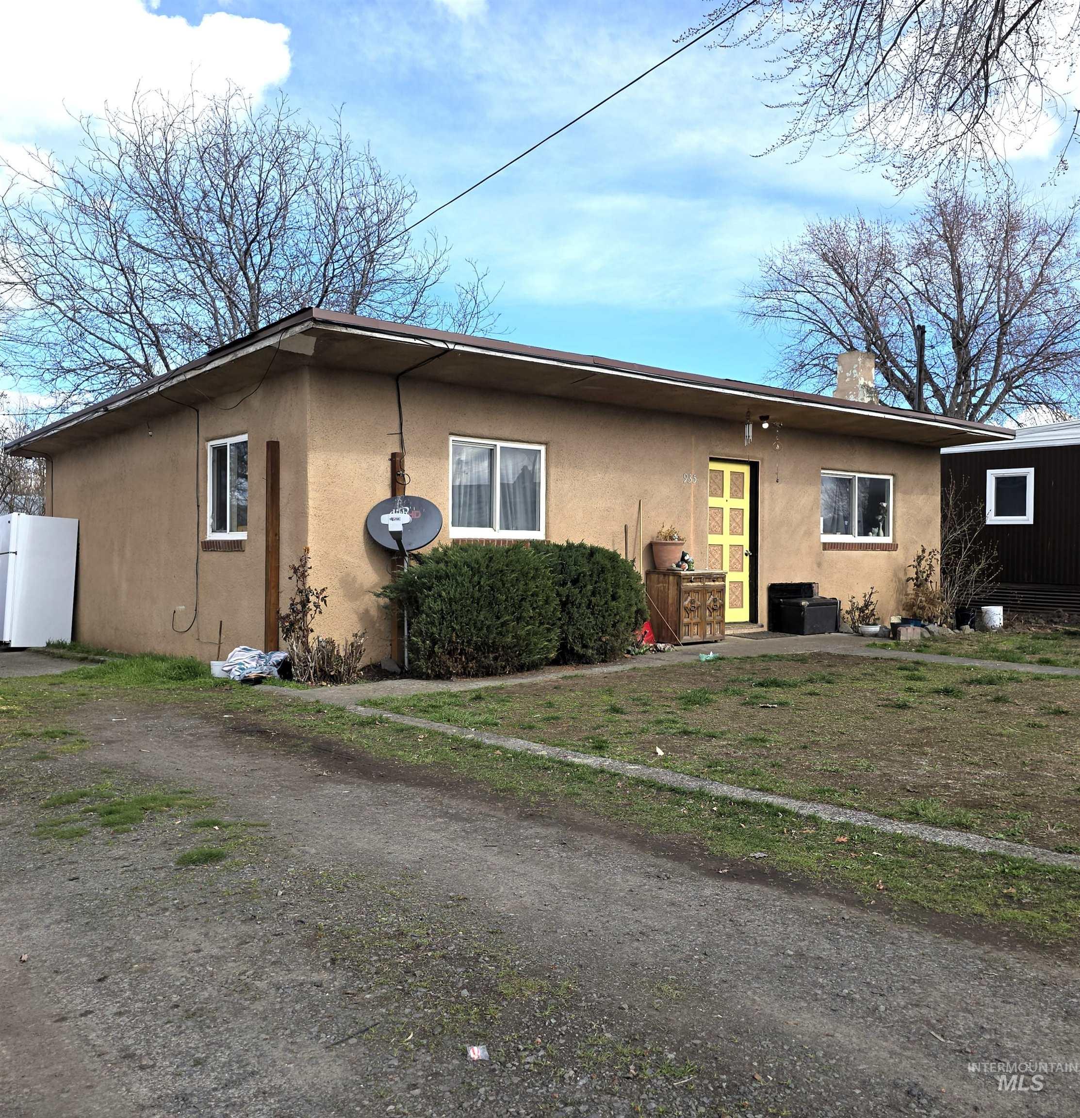 935 Preston Avenue Lewiston, ID 83501 - Photo 1 of 22 View of home's exterior with stucco siding and a patio area