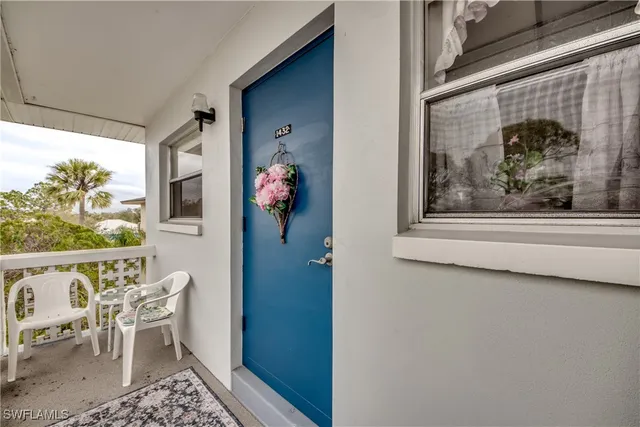 a view of a dining room with a table and chairs
