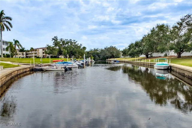 a view of a lake with boats and trees