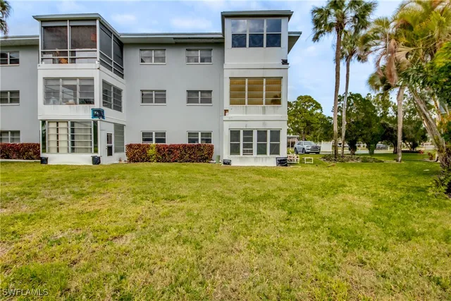 a front view of building with yard