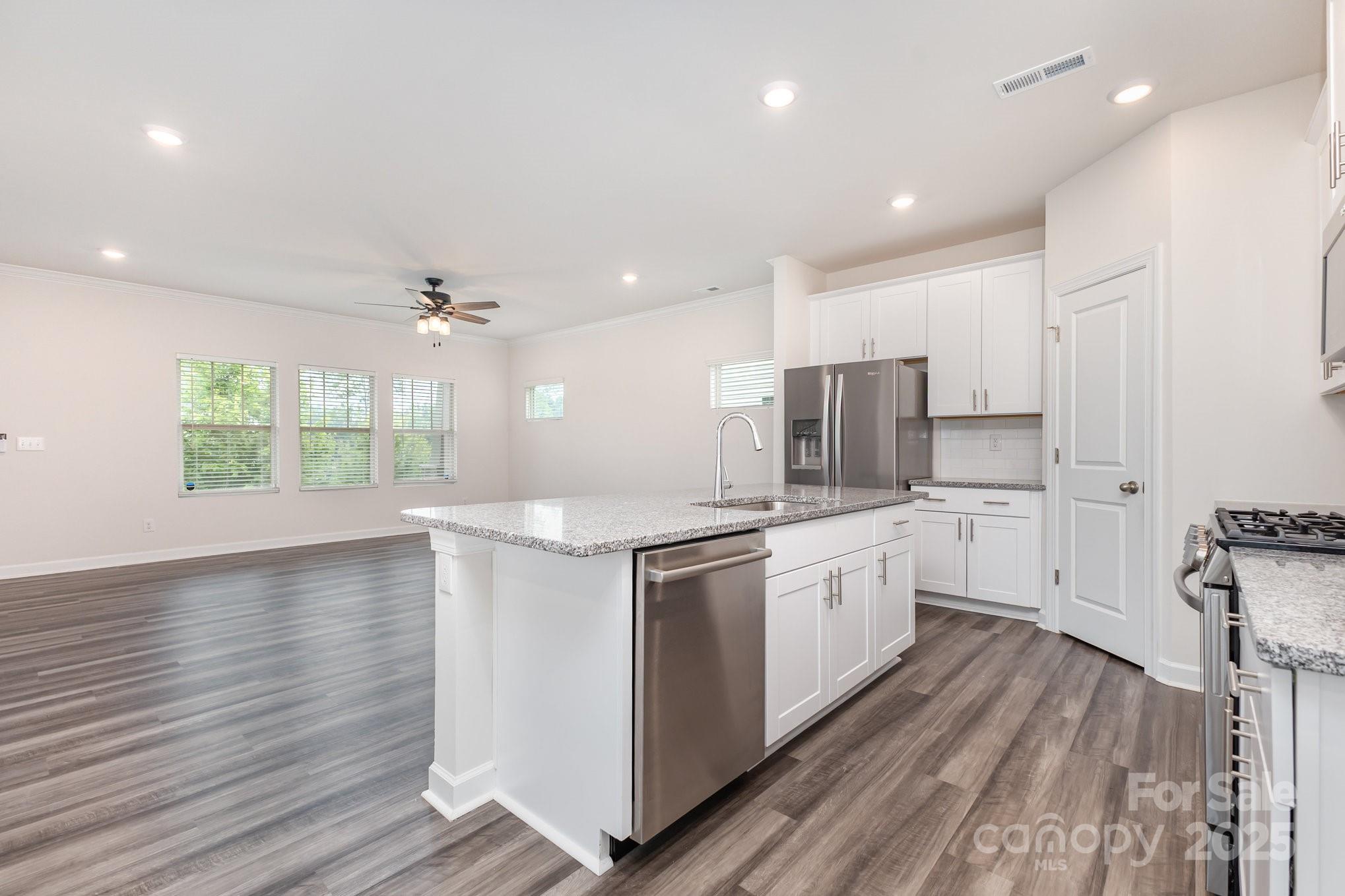 4003 Armstrong Farm Drive Belmont, NC 28012 - Photo 12 of 32 a kitchen with a white wooden cabinets and white appliances