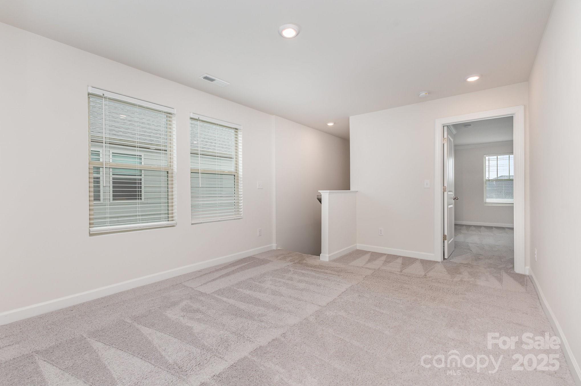 4003 Armstrong Farm Drive Belmont, NC 28012 - Photo 17 of 32 an empty room with windows