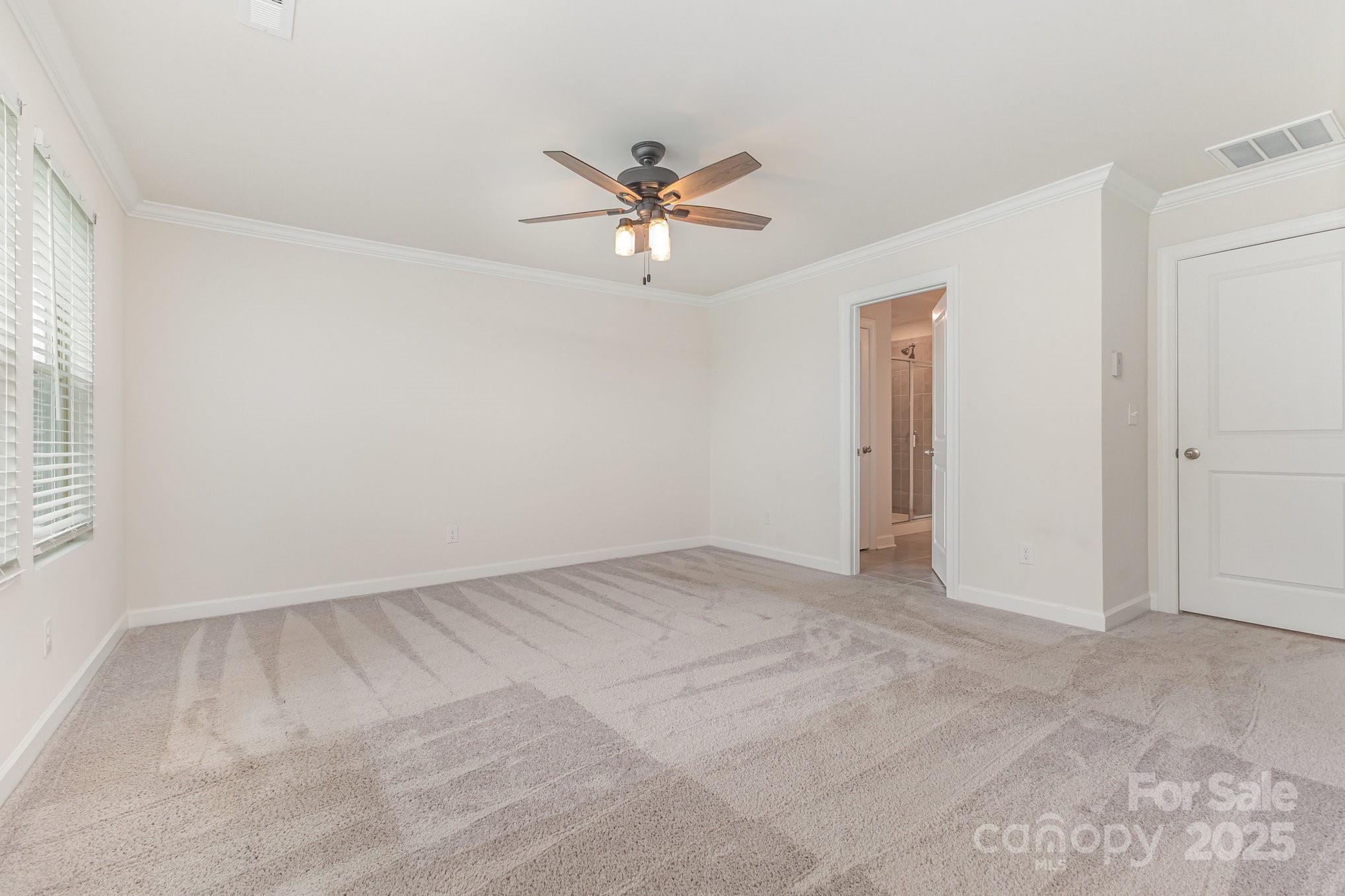 4003 Armstrong Farm Drive Belmont, NC 28012 - Photo 25 of 32 an empty room with closet and a ceiling fan