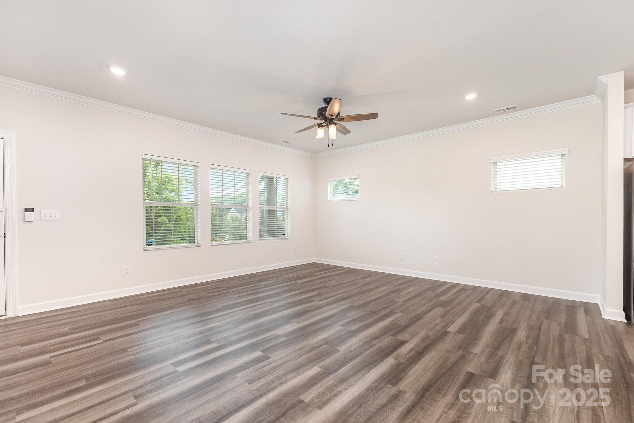 4003 Armstrong Farm Drive Belmont, NC 28012 - Photo 9 of 32 wooden floor in an empty room with a window