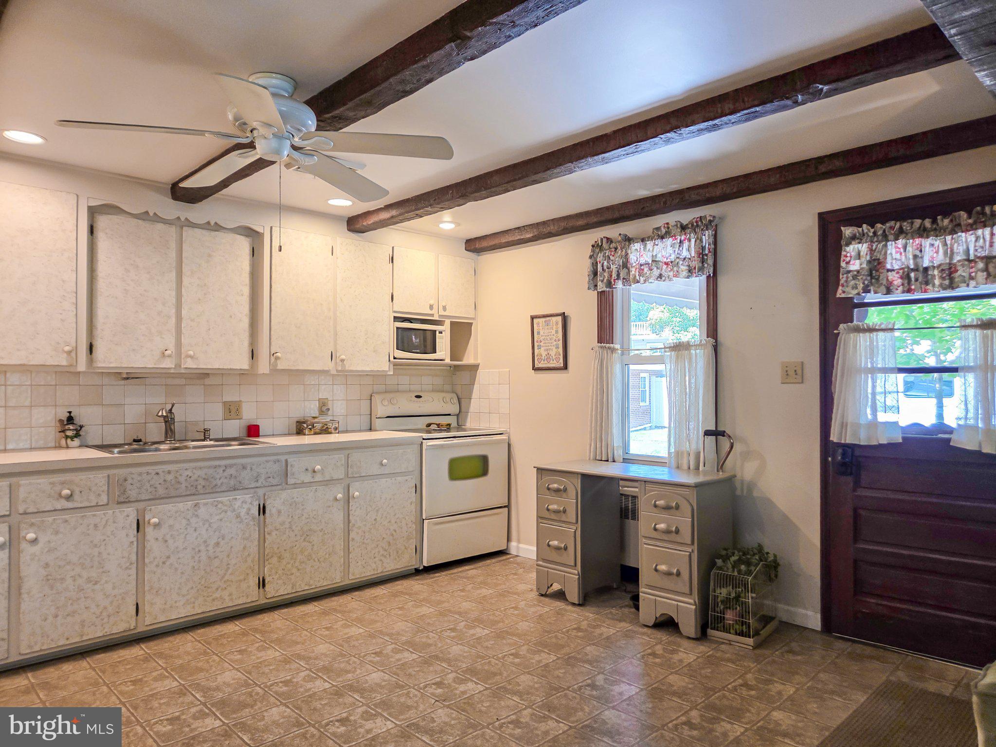 524 Locust Street Denver, PA 17517 - Photo 14 of 36 Charming kitchen with rustic beams.
