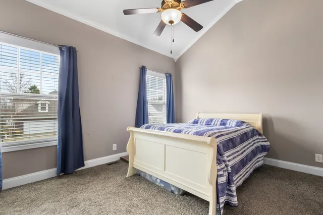 a bed room with a bed and a window