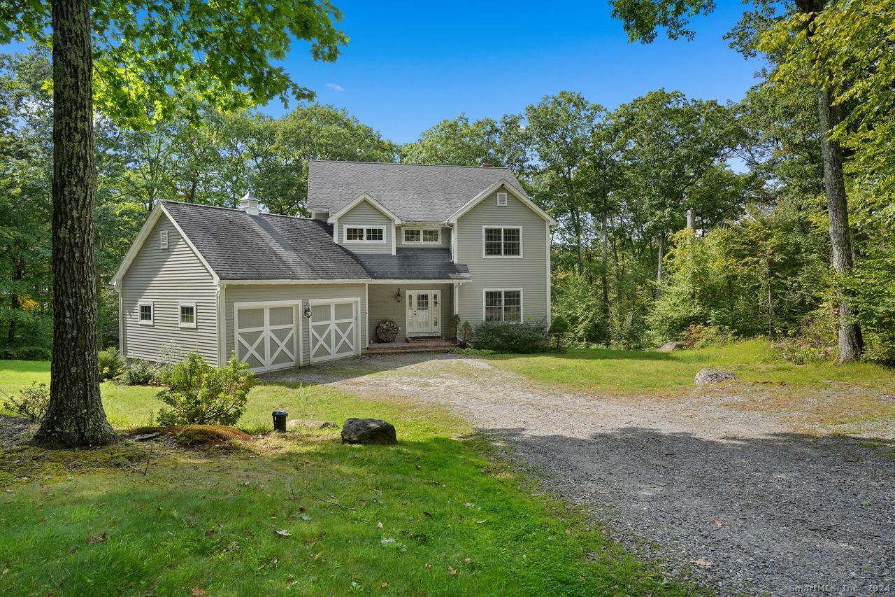 6 Bobcat Lane Warren, CT 06754 - Photo 1 of 1 a front view of a house with garden