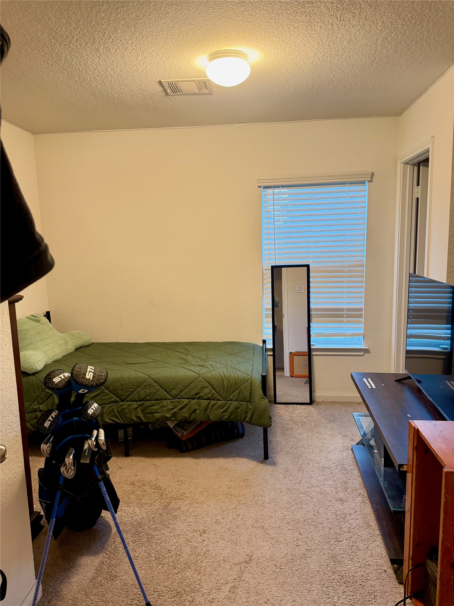 4139 Sam Houston Road Willis, TX 77378 - Photo 13 of 26 Bedroom 1: Has carpet and en-suite bath.