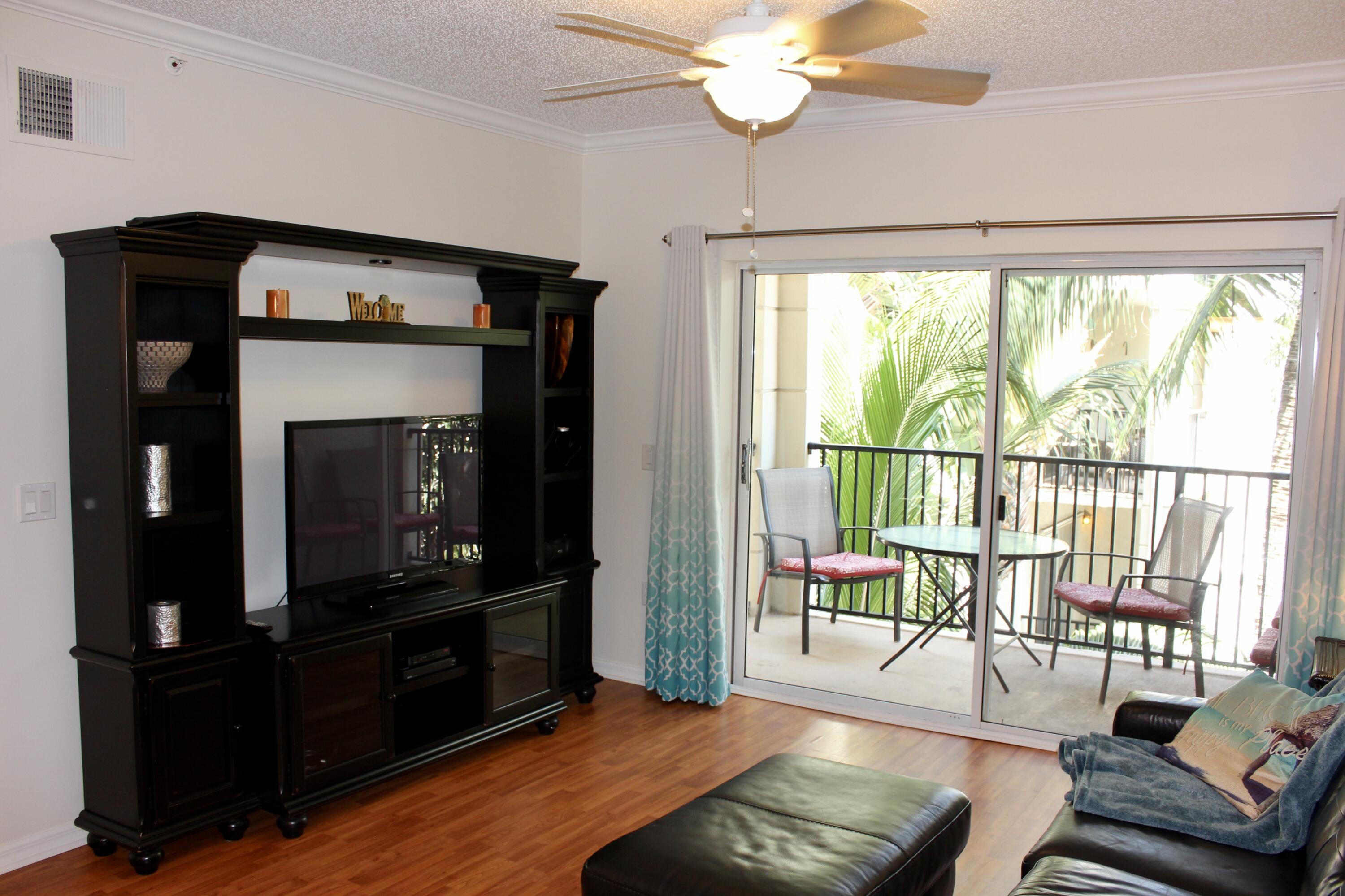 3302 Tuscany Way Boynton Beach, FL 33435 - Photo 11 of 62 a living room with furniture and a flat screen tv