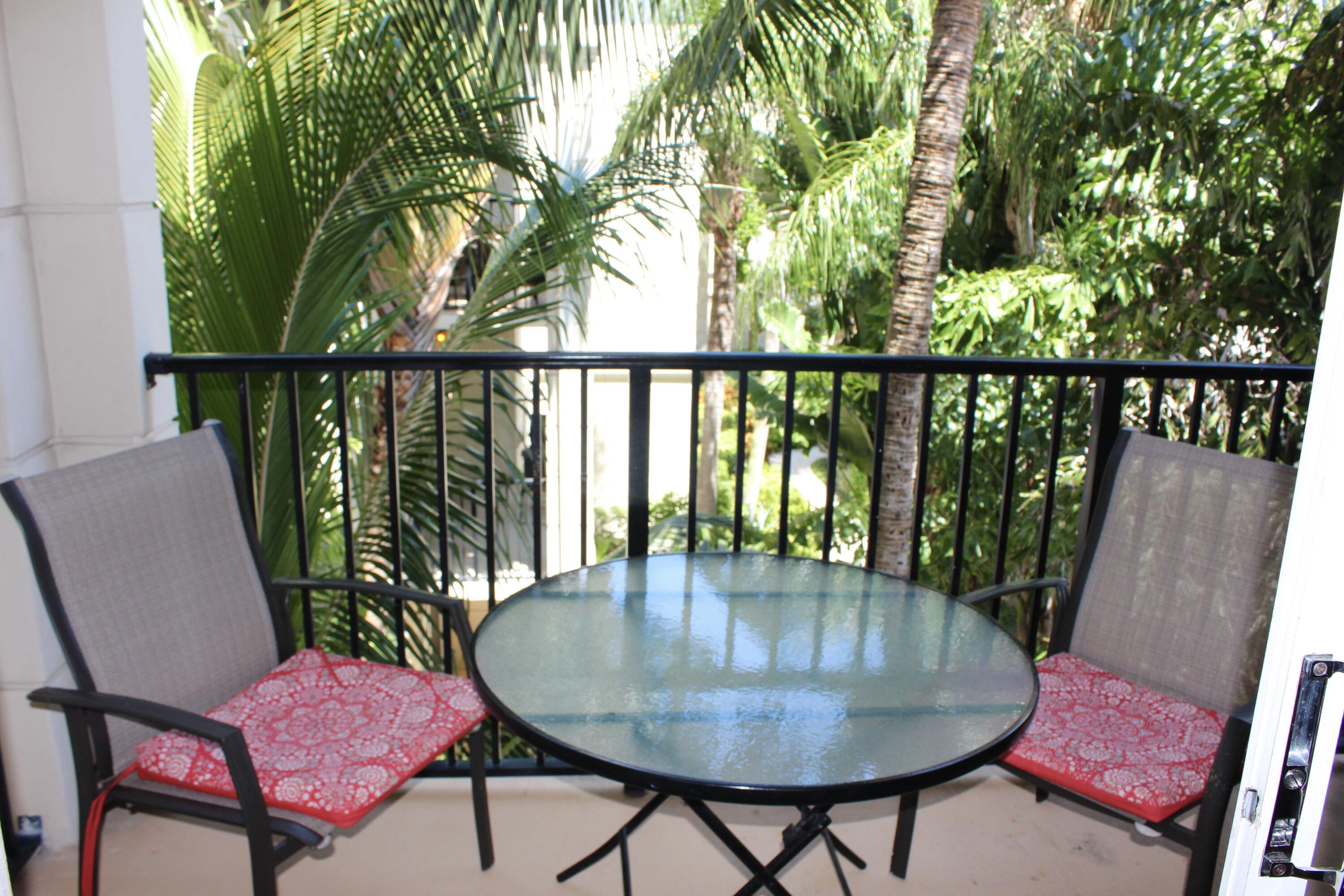 3302 Tuscany Way Boynton Beach, FL 33435 - Photo 13 of 62 a view of a balcony with a table