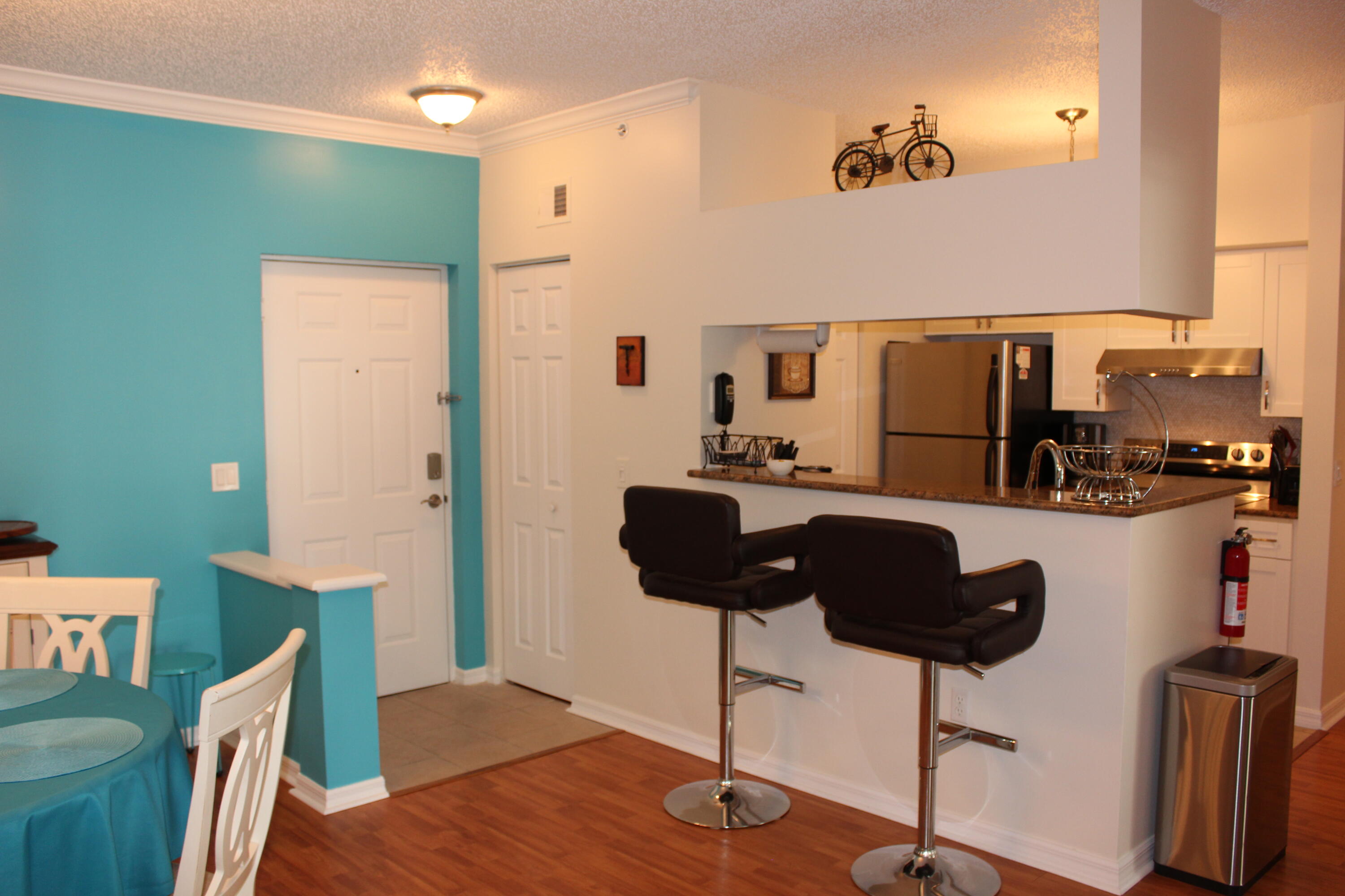 3302 Tuscany Way Boynton Beach, FL 33435 - Photo 15 of 62 a living room with furniture and a chandelier
