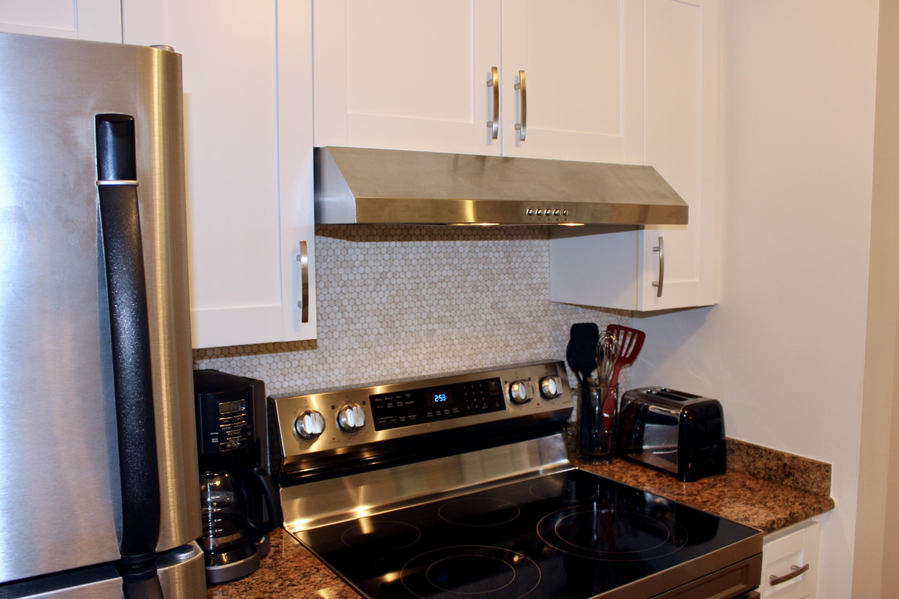 3302 Tuscany Way Boynton Beach, FL 33435 - Photo 17 of 62 a kitchen with a stove and a sink