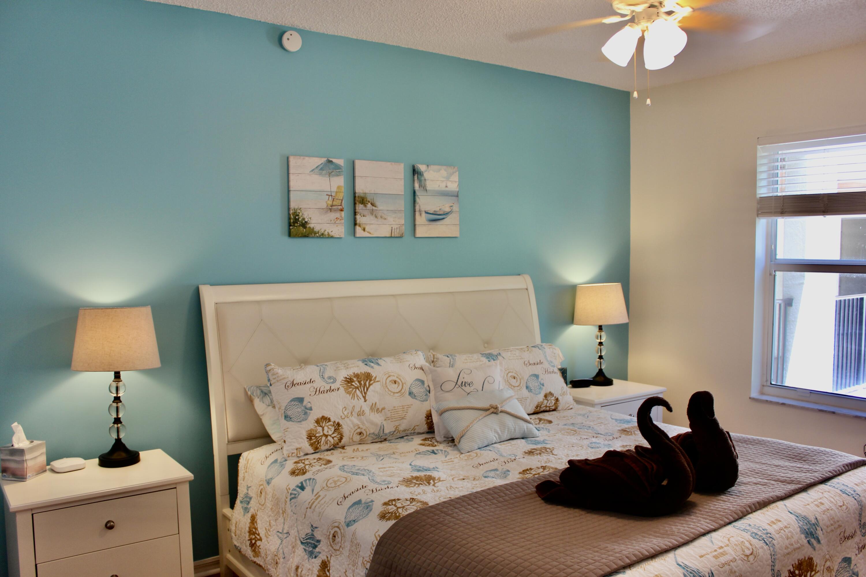 3302 Tuscany Way Boynton Beach, FL 33435 - Photo 24 of 62 a bed room with a bed and a lamp