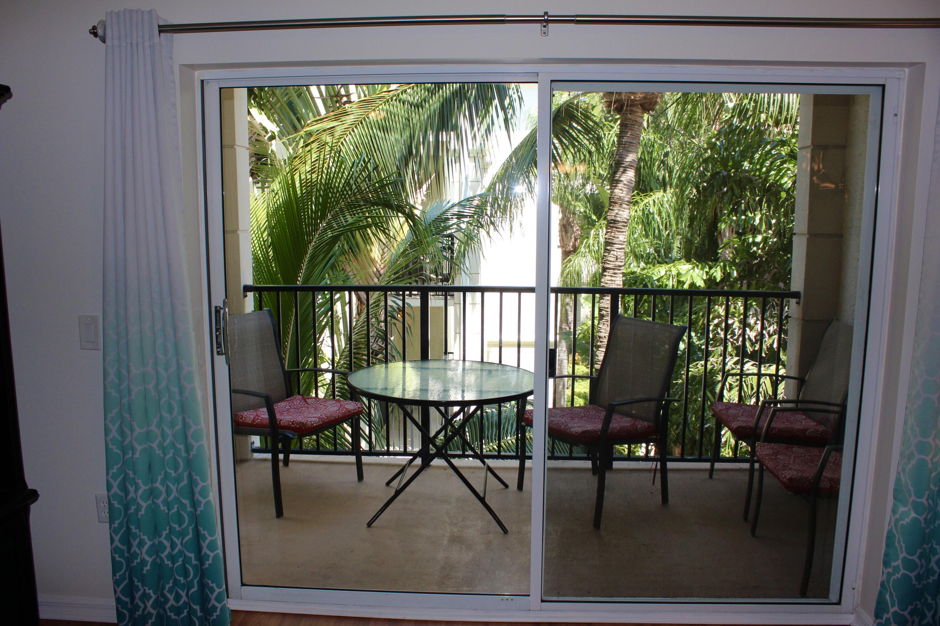 3302 Tuscany Way Boynton Beach, FL 33435 - Photo 30 of 62 a view of a chairs and table in a balcony