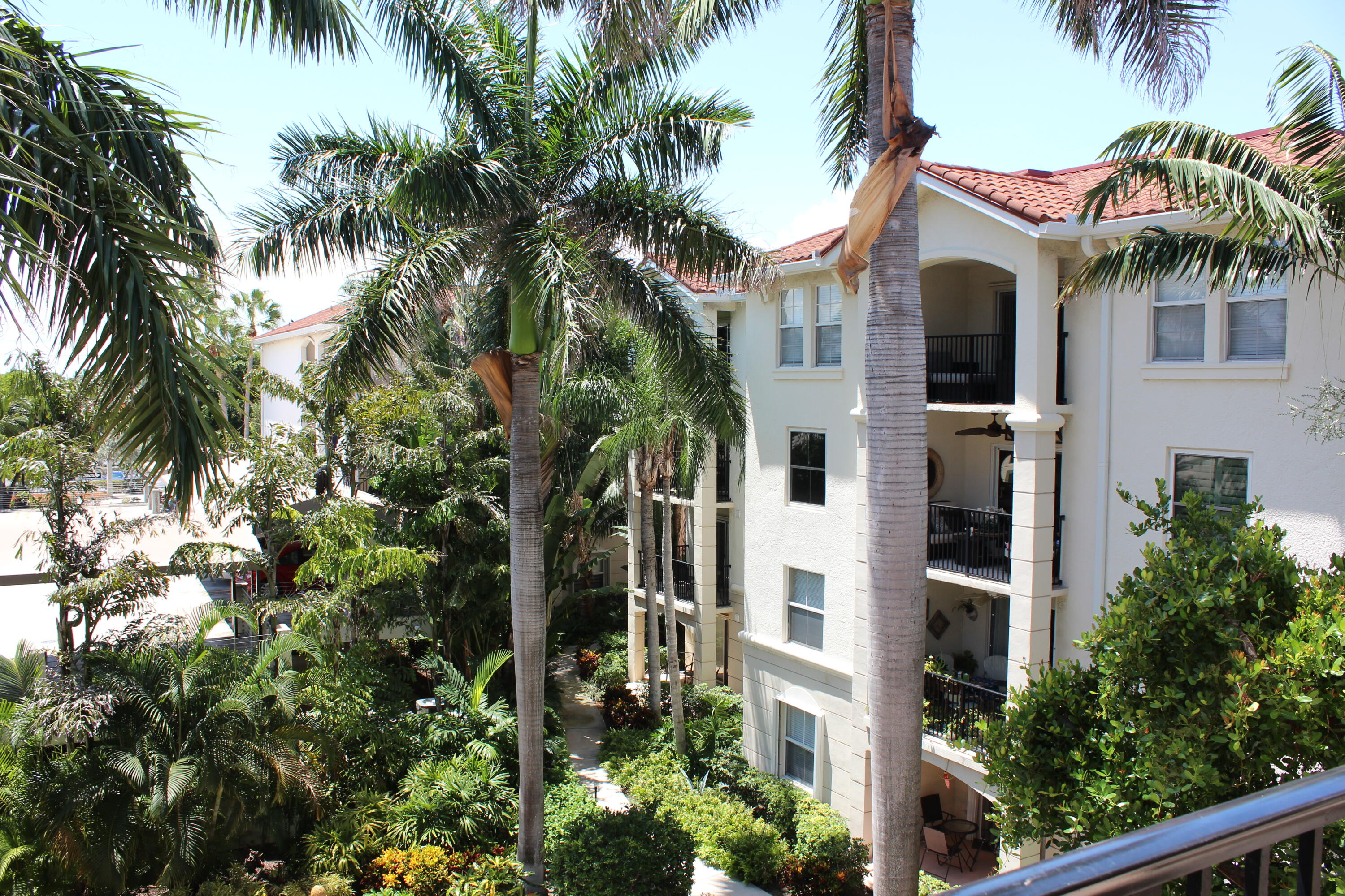 3302 Tuscany Way Boynton Beach, FL 33435 - Photo 41 of 62 a view of a white house with a palm tree
