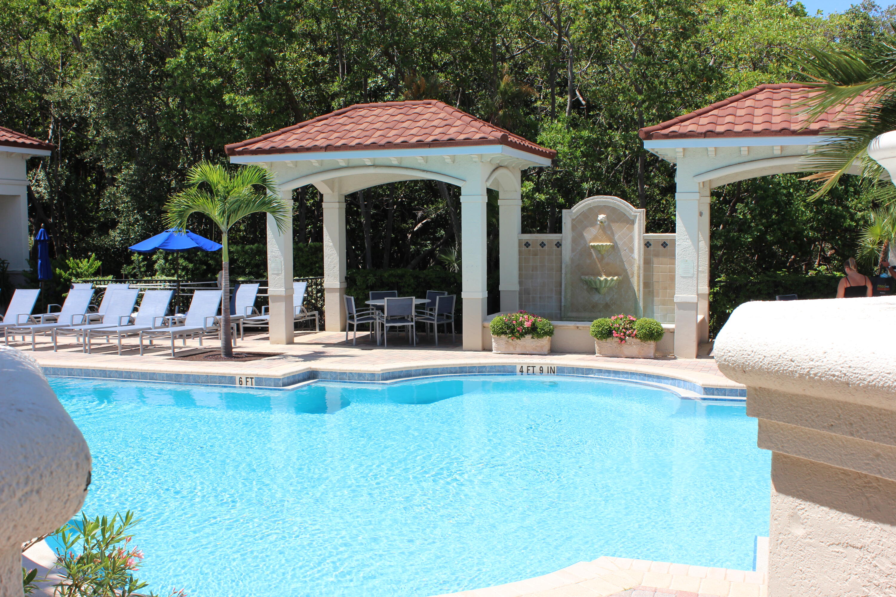 3302 Tuscany Way Boynton Beach, FL 33435 - Photo 46 of 62 a view of a house with swimming pool and sitting area