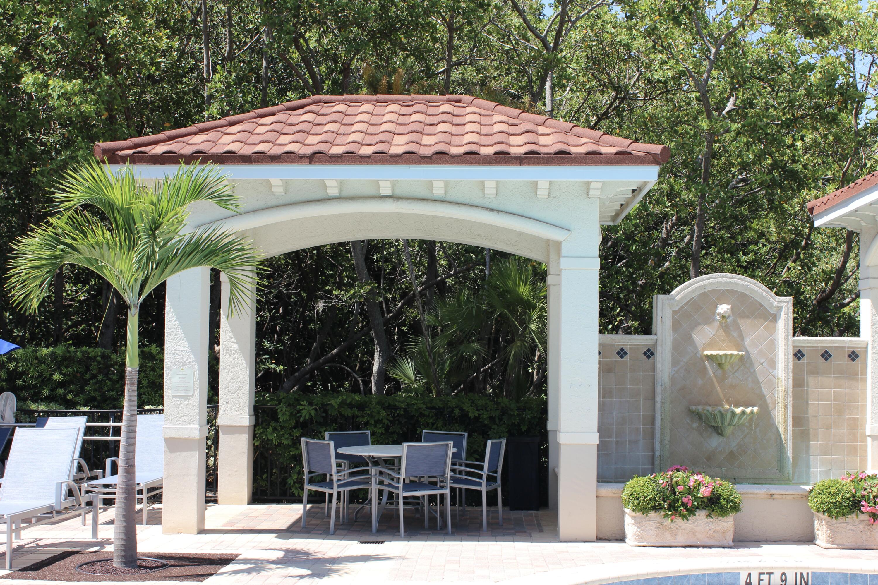 3302 Tuscany Way Boynton Beach, FL 33435 - Photo 47 of 62 a front view of a house with garden