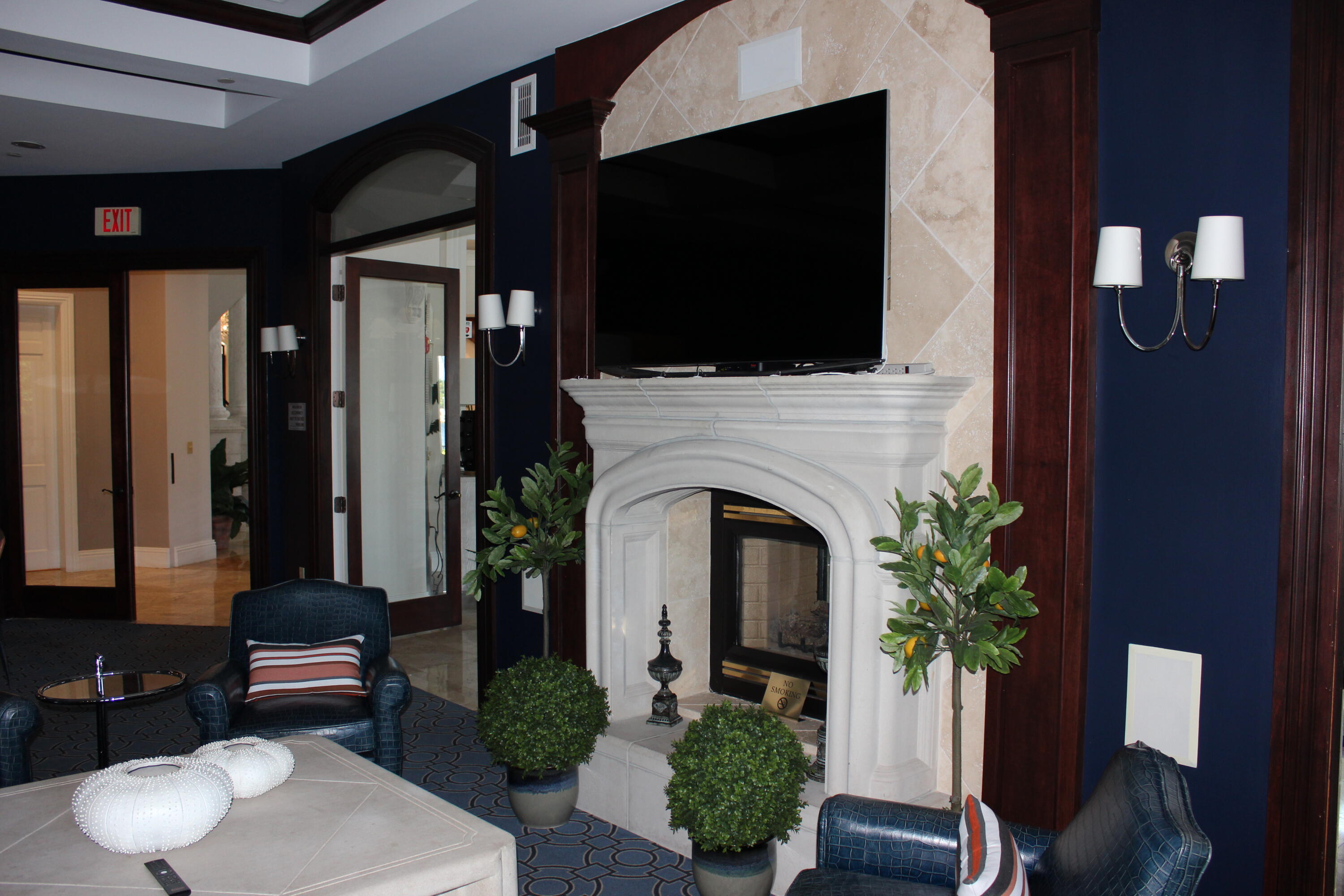 3302 Tuscany Way Boynton Beach, FL 33435 - Photo 57 of 62 a living room with furniture a flat screen tv and a fireplace