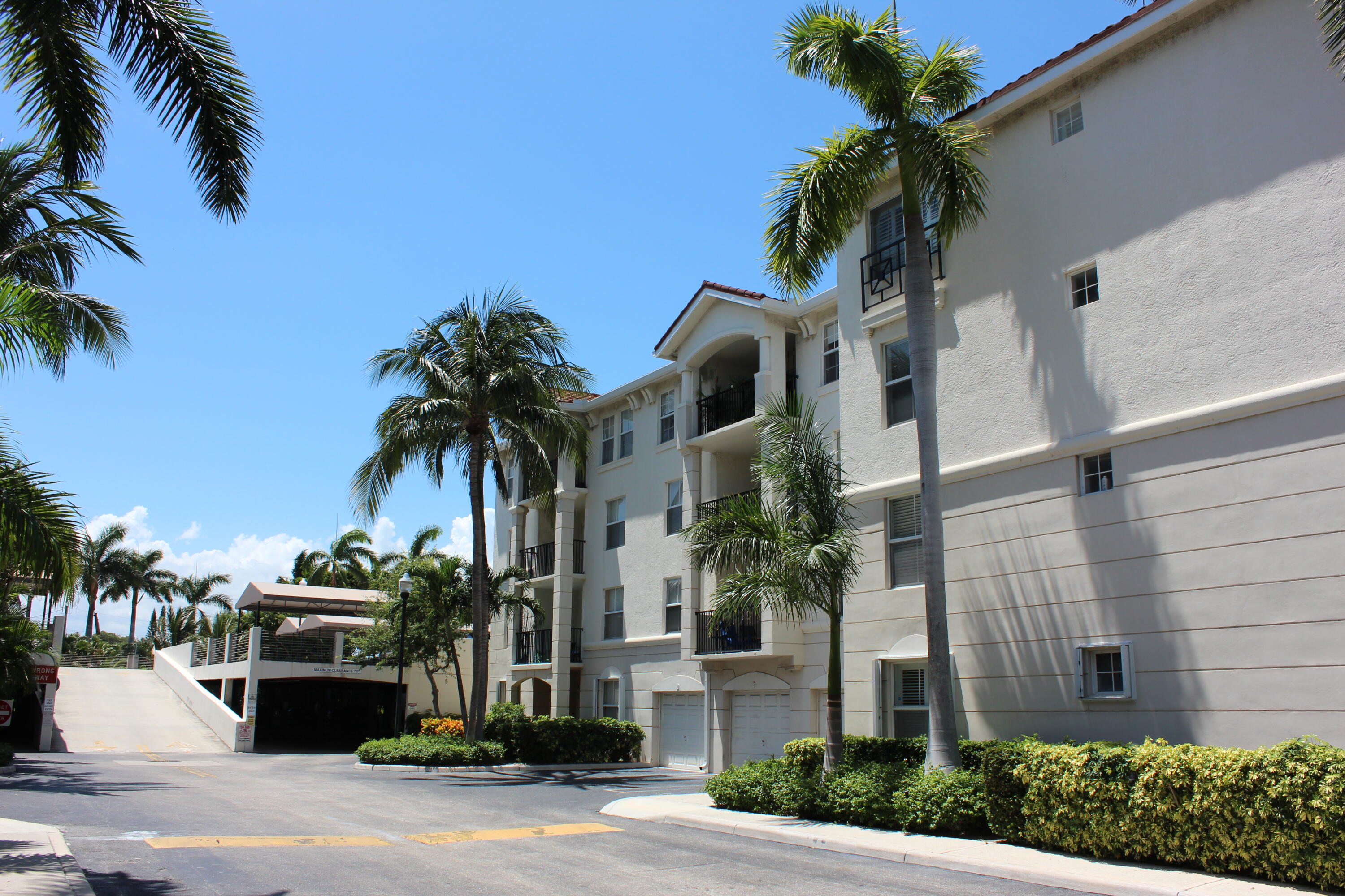 3302 Tuscany Way Boynton Beach, FL 33435 - Photo 7 of 62 a view of a palm trees in front of a building