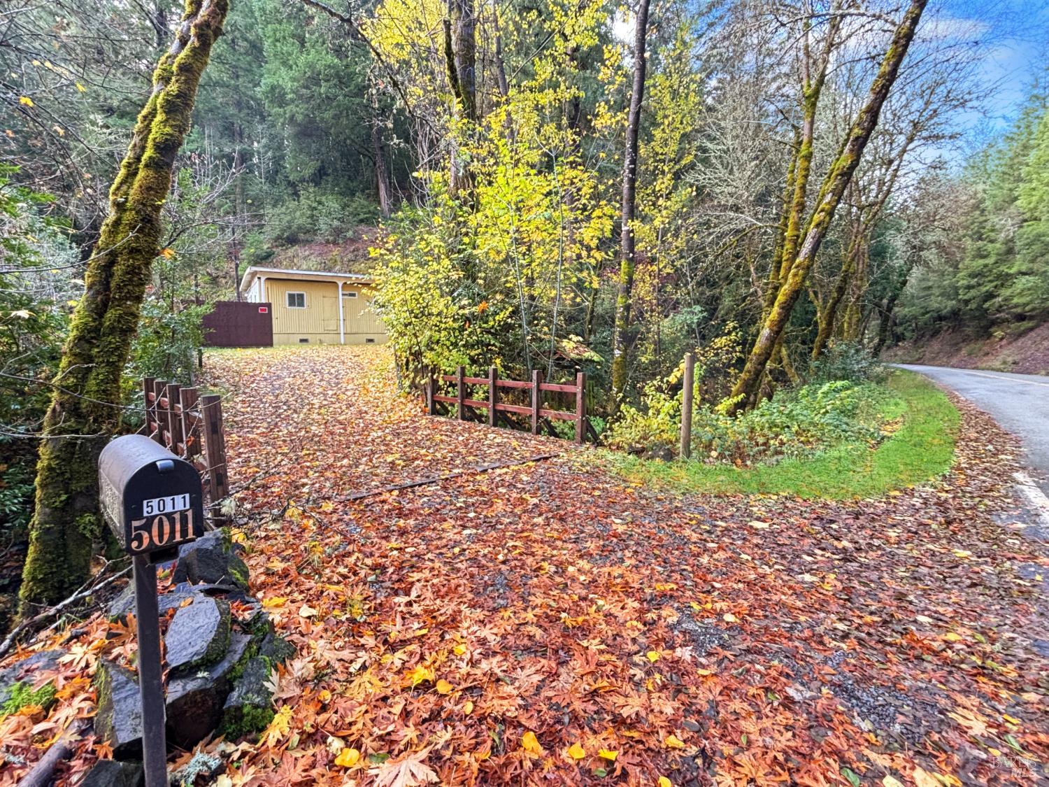 5011 Canyon Road Willits, CA 95490 - Photo 2 of 16 a front view of a house with a yard