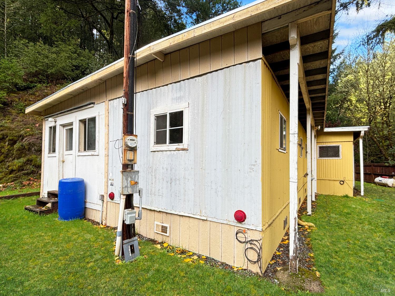 5011 Canyon Road Willits, CA 95490 - Photo 3 of 16 a front view of a house with garden