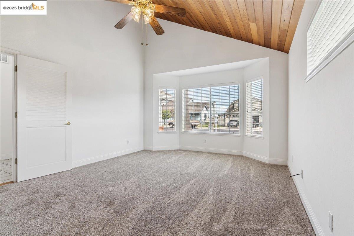5752 Drakes Drive Discovery Bay, CA 94505 - Photo 15 of 32 an empty room with windows and fan