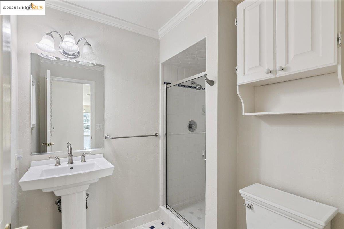 5752 Drakes Drive Discovery Bay, CA 94505 - Photo 19 of 32 a bathroom with a sink a toilet and mirror