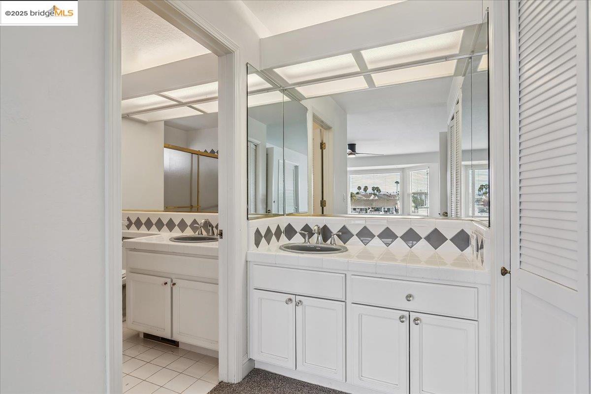 5752 Drakes Drive Discovery Bay, CA 94505 - Photo 20 of 32 a bathroom with a sink and a mirror