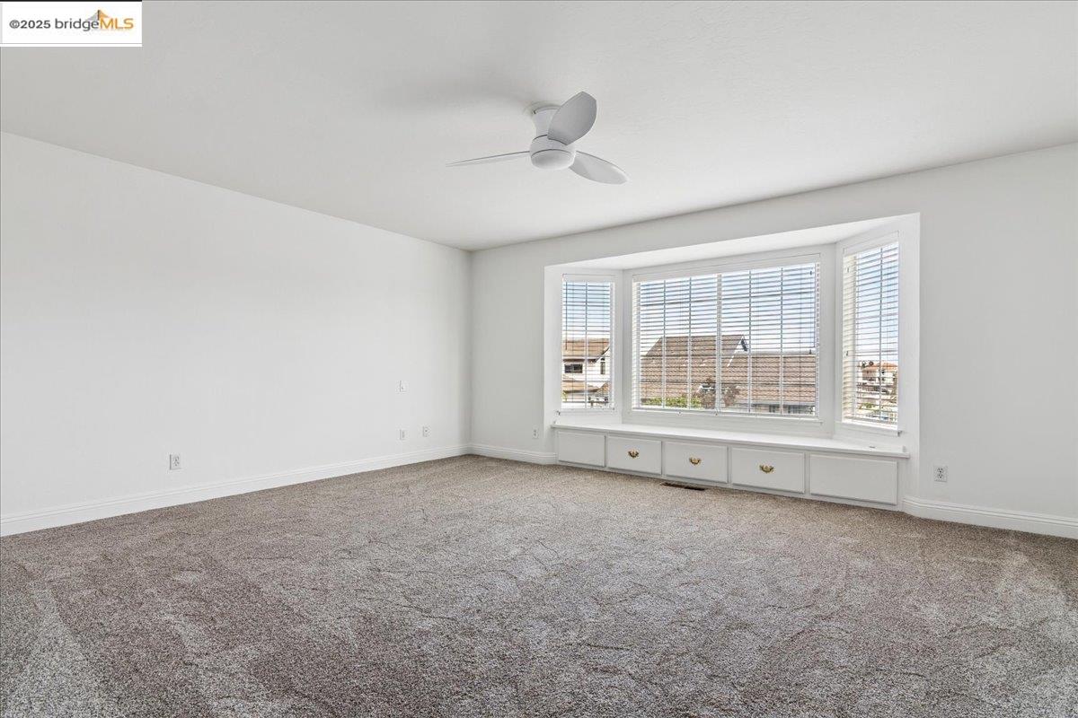 5752 Drakes Drive Discovery Bay, CA 94505 - Photo 23 of 32 an empty room with windows