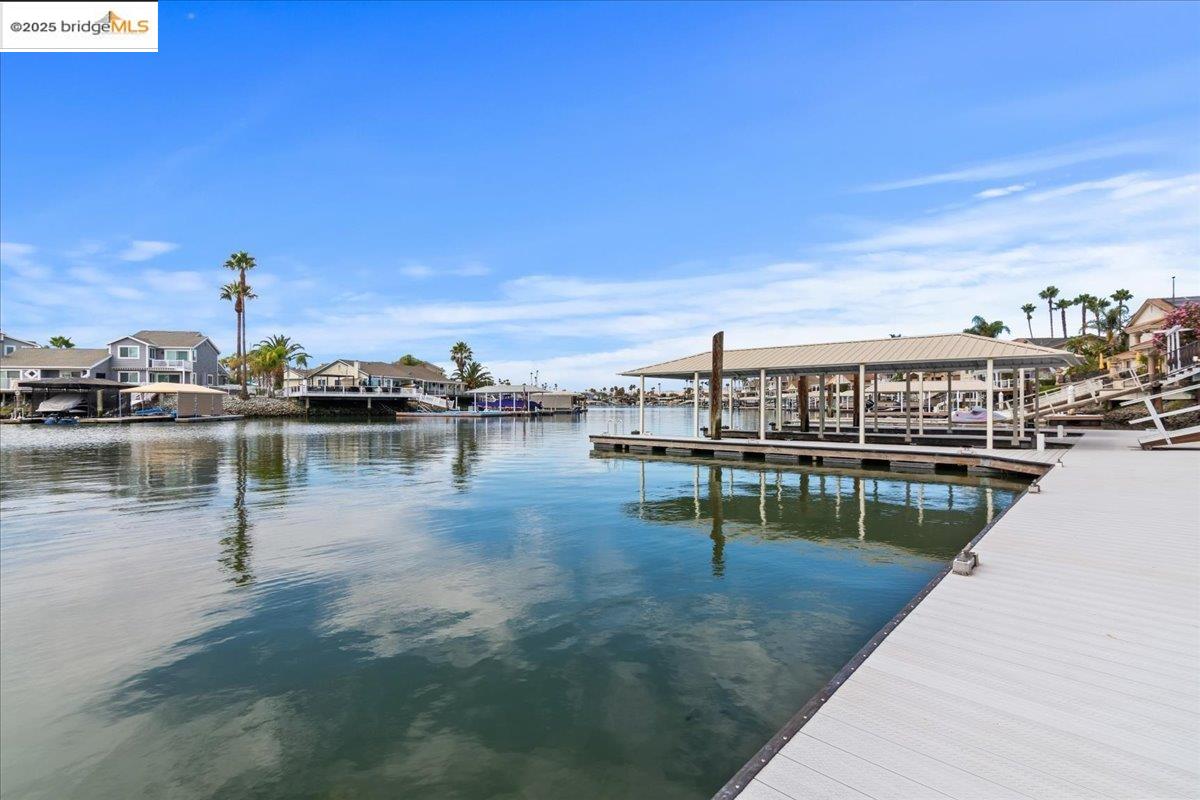 5752 Drakes Drive Discovery Bay, CA 94505 - Photo 28 of 32 a view of a lake with a city