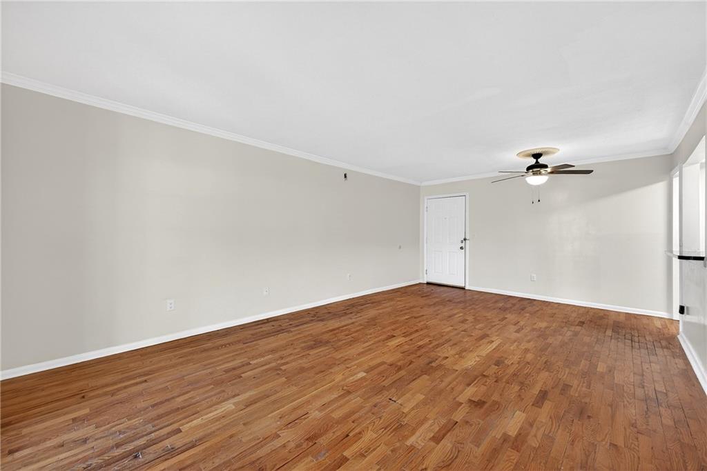 1150 Collier Road Northwest, Unit K9 Atlanta, GA 30318 - Photo 2 of 28 a view of empty room with wooden floor