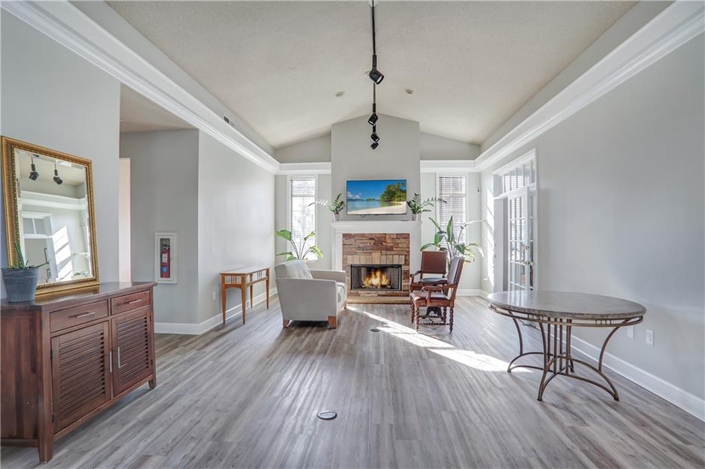 1150 Collier Road Northwest, Unit K9 Atlanta, GA 30318 - Photo 23 of 28 a living room with furniture and a fireplace