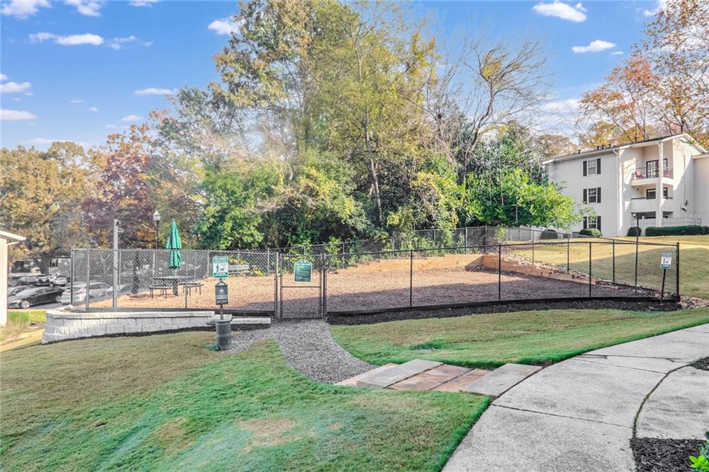1150 Collier Road Northwest, Unit K9 Atlanta, GA 30318 - Photo 24 of 28 a view of a yard with tree s