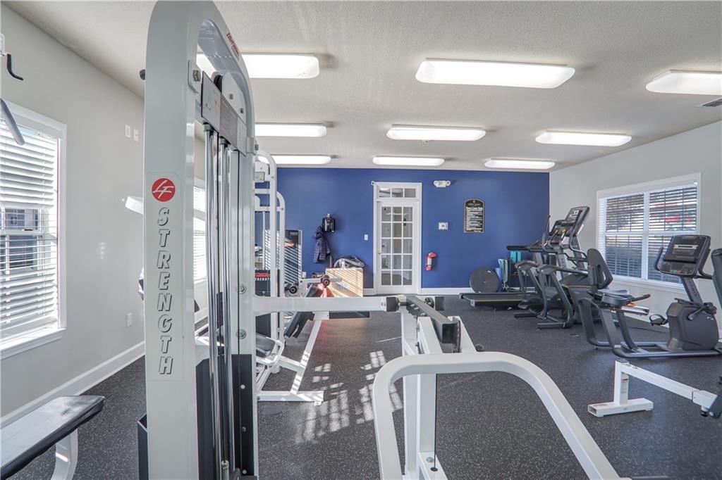 1150 Collier Road Northwest, Unit K9 Atlanta, GA 30318 - Photo 26 of 28 a view of a livingroom with furniture and a window