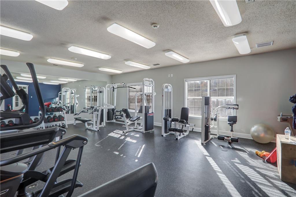 1150 Collier Road Northwest, Unit K9 Atlanta, GA 30318 - Photo 27 of 28 a view of a room with gym equipment