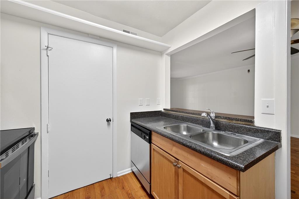 1150 Collier Road Northwest, Unit K9 Atlanta, GA 30318 - Photo 9 of 28 a bathroom with a sink and a mirror