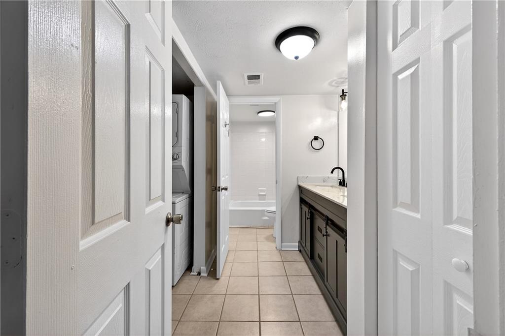 1150 Collier Road Northwest, Unit K9 Atlanta, GA 30318 - Photo 10 of 28 a bathroom with a double vanity sink and a mirror