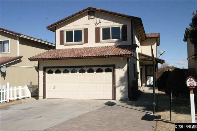 7005 Peppermint Drive Reno, NV 89506 - Photo 1 of 1 a front view of a house with parking
