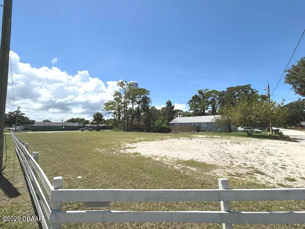 a view of a lake with a yard