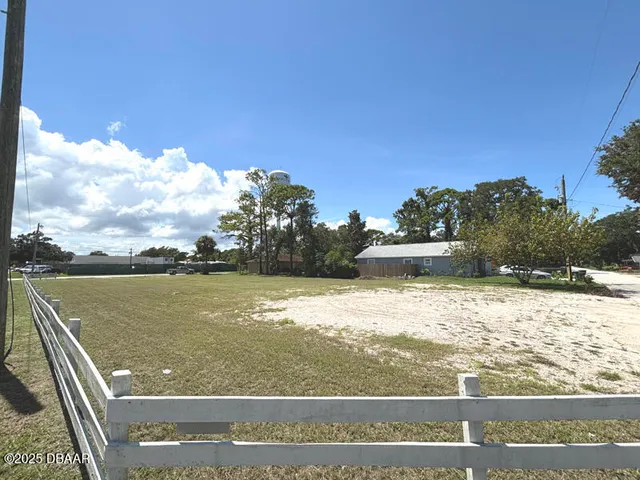 a view of a lake with a yard