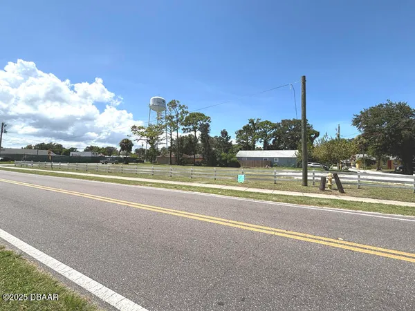 a view of a building with a yard