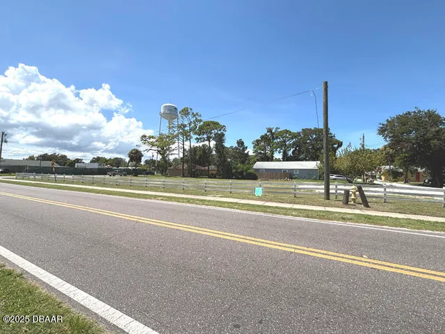 a view of a building with a yard