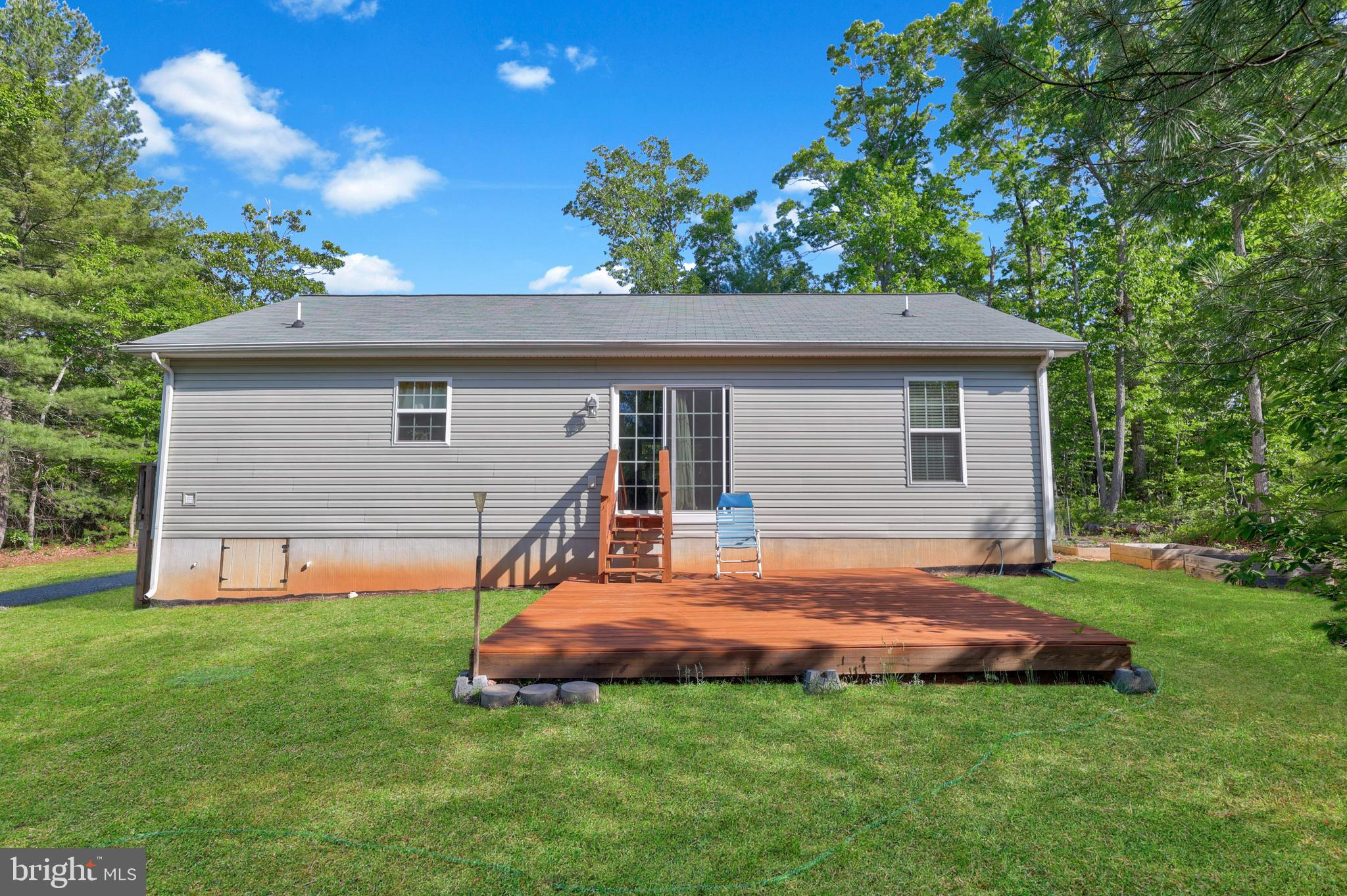 470 Jacoby Road Louisa, VA 23093 - Photo 11 of 16 a view of a house with a backyard