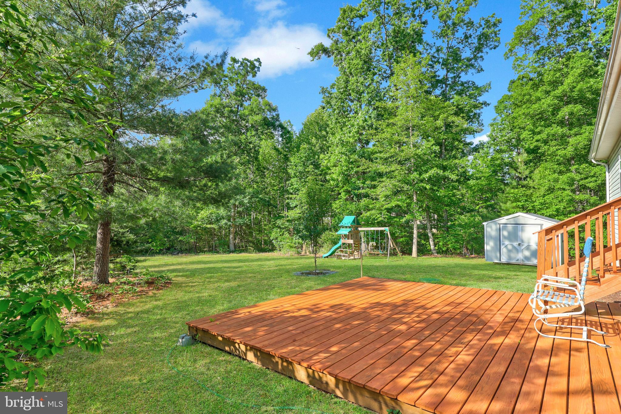 470 Jacoby Road Louisa, VA 23093 - Photo 13 of 16 a view of a backyard with wooden floor