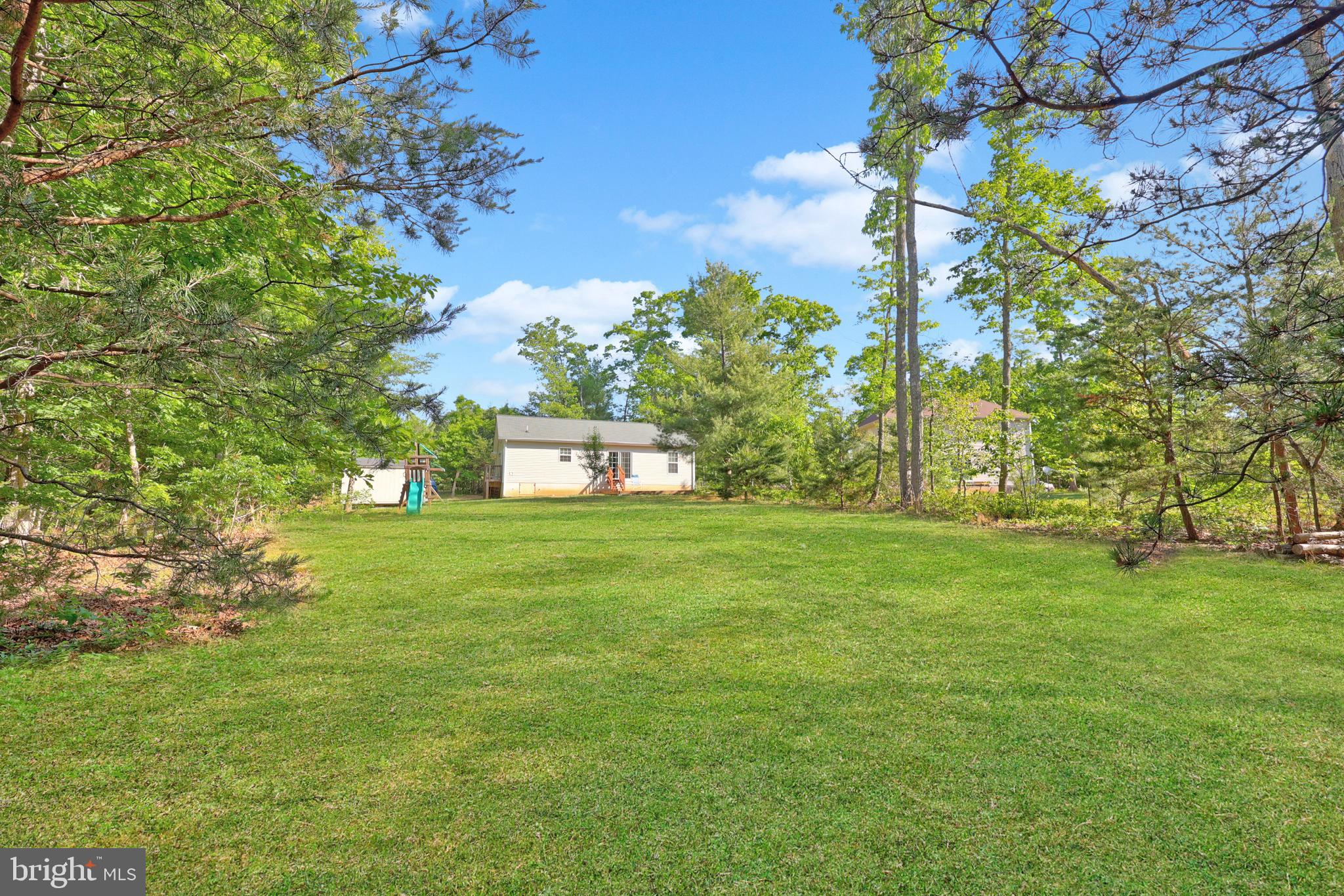 470 Jacoby Road Louisa, VA 23093 - Photo 15 of 16 a yellow building with trees in front of it