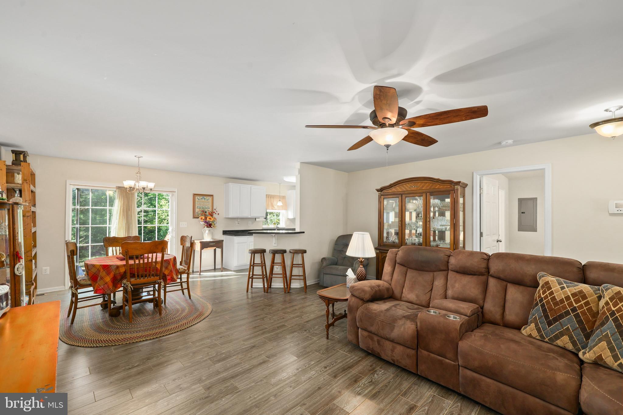 470 Jacoby Road Louisa, VA 23093 - Photo 5 of 16 a living room with furniture a fireplace and a large window