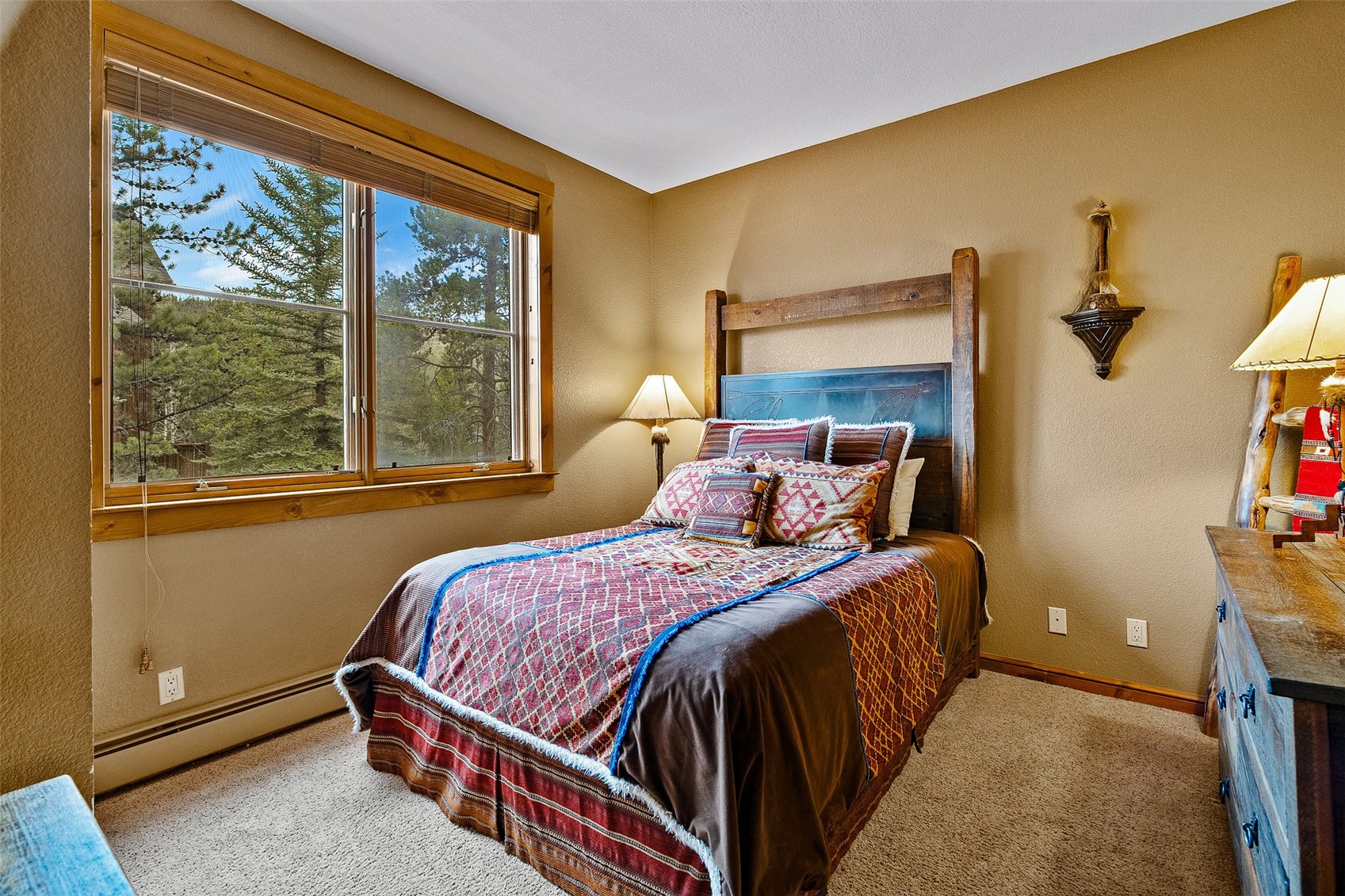 57 Lake Ridge Circle, Unit 1848 Keystone, CO 80435 - Photo 32 of 49 a bed sitting in a bedroom next to a window