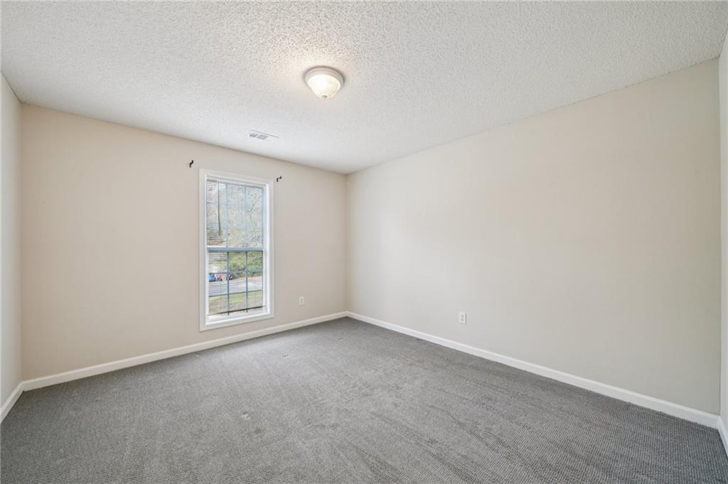 480 Raider Way Bethlehem, GA 30620 - Photo 13 of 30 an empty room with windows