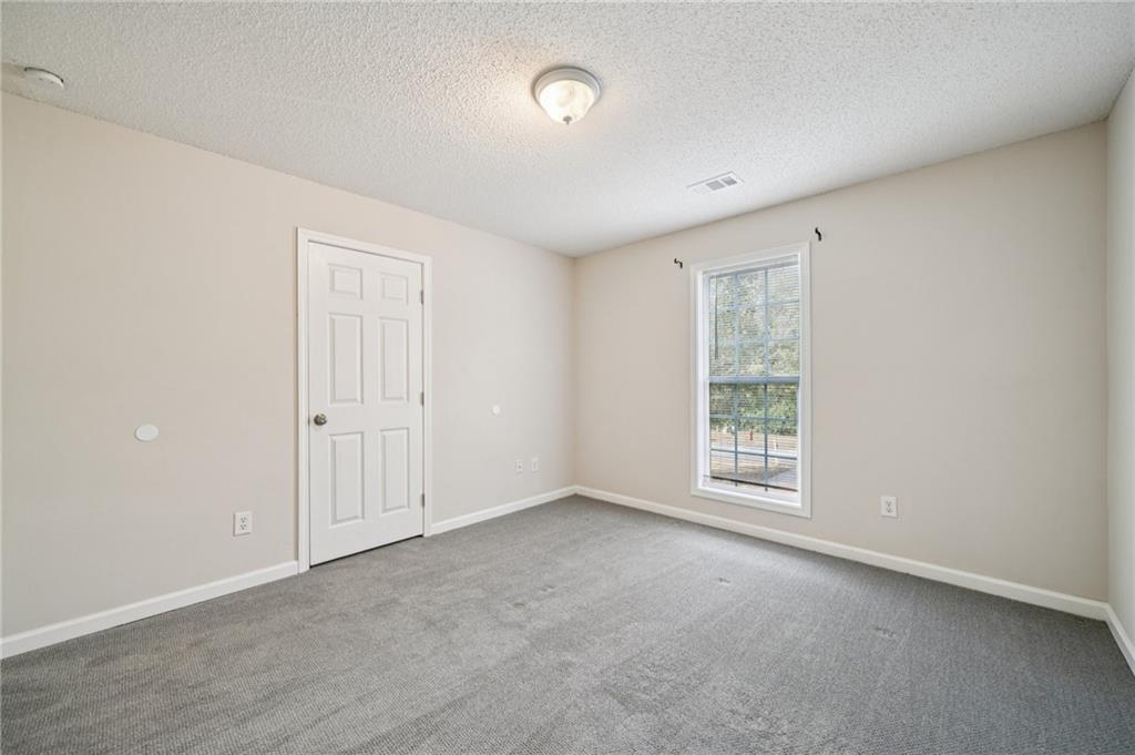 480 Raider Way Bethlehem, GA 30620 - Photo 14 of 30 an empty room with windows