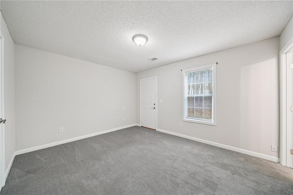 480 Raider Way Bethlehem, GA 30620 - Photo 18 of 30 an empty room with windows